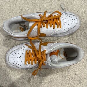 White and orange Nike sneakers